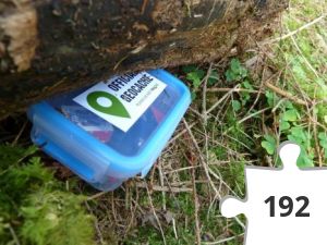 Jigsaw puzzle - A Cache by a Log