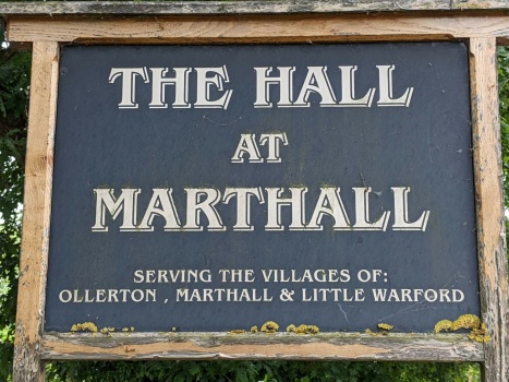 Solve Marthall Village Hall Sign jigsaw puzzle online with 63 pieces